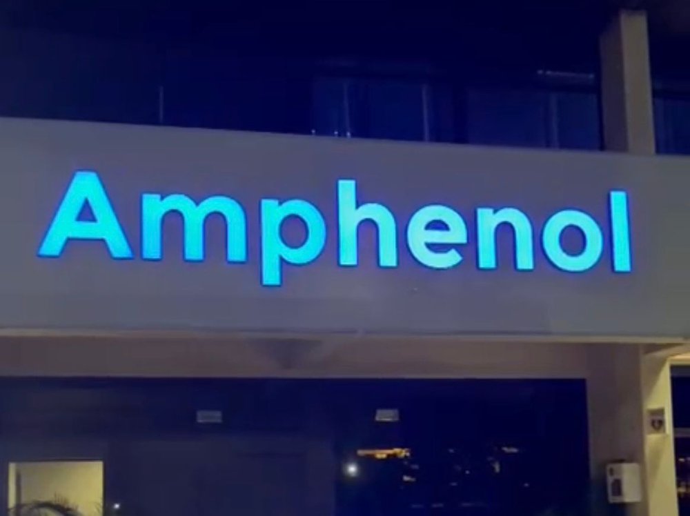 Illuminated LED signboard at night, Amphenol Singapore